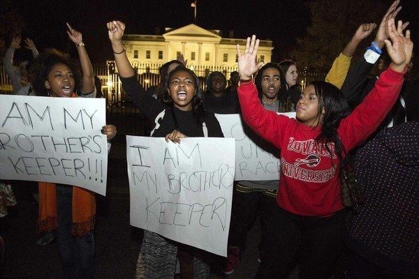 Protesters demonstrate after the decision by a Missouri grand jury not to indict a white Ferguson police officer in the fatal shooting of unarmed black teenager Brown, in front of the White House in Washington