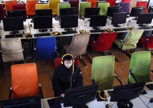 A customer uses computer in an internet cafe at Changzhi