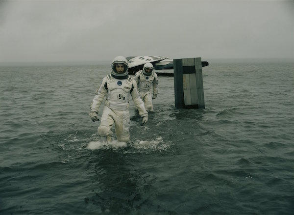 ***SUNDAY CALENDAR  SNEAKS STORY FOR NOVEMBER 2, 2014. DO NOT USE PRIOR TO PUBLICATION********** Left to right: Anne Hathaway and Wes Bently in the movie INTERSTELLAR, from Paramount Pictures and Warner Brothers Pictures, in association with Legendary Pictures.__CHRISTOPHER NOLAN INFO.__Our robot design was based on the idea of retreating from any notion of anthropomorphic appearance.  The great actor Bill Irwin had to give the robots personality using the most basic of movements, even when wading through water.  An incredible performance challenge for Bill, but one he rose to admirably.