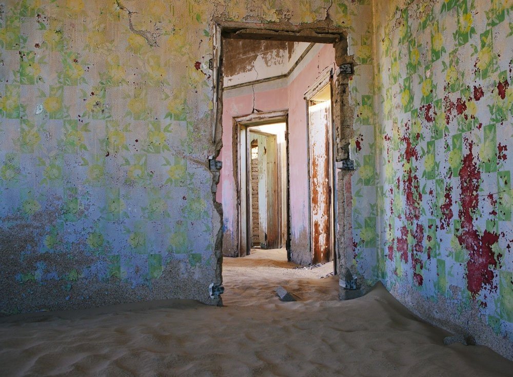 the-wallpaper-is-different-in-each-room-and-the-contrast-of-these-incredibly-colorful-old-peeling-wallpapers-and-the-sand-is-so-surreal-she-says