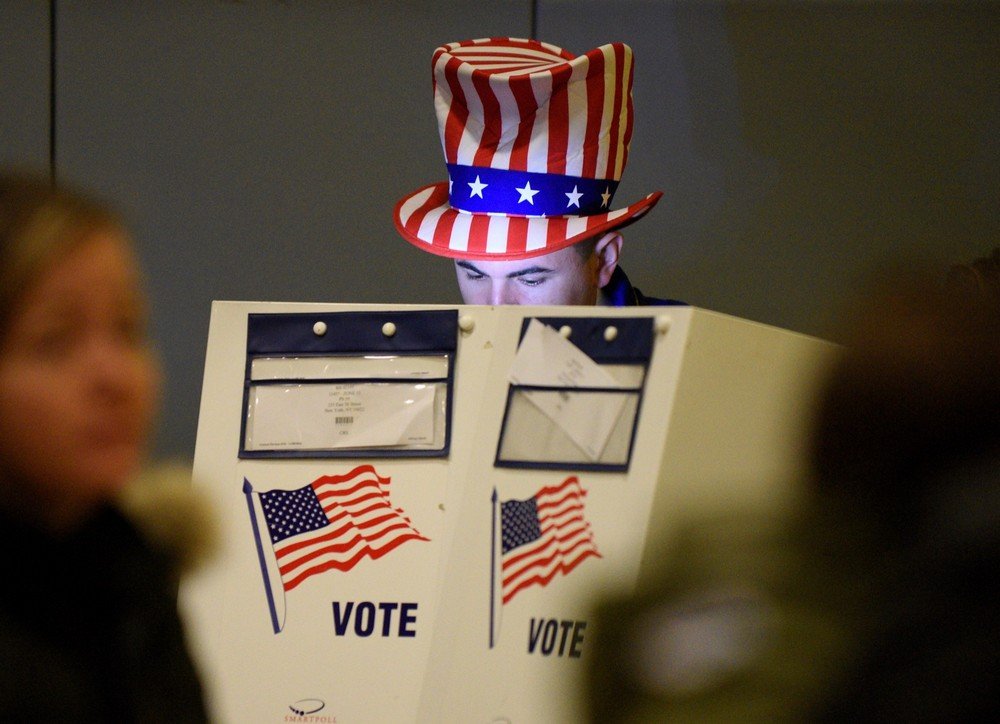 Travis Lopes, 30, casts his vote for the U.S. presidential election in the Manhattan borough of New York